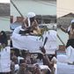 Paramount chief of Elmina joyfully dances to King Paluta's Aseda in palanquin