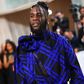 Burna Boy's outfit at the Met Gala has received praise from both fashion enthusiasts and fans, with many applauding his bold and stylish choice of attire.  [Yabaleftonline]