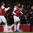 Arsenal striker Alexandre Lacazette (centre) celebrates his equaliser in a 1-1 draw with Liverpool that stretched the Gunners' unbeaten run to 14 matches