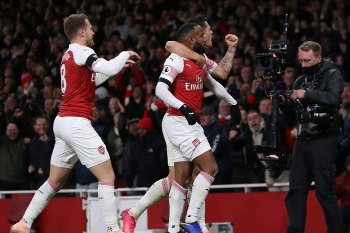 Arsenal striker Alexandre Lacazette (centre) celebrates his equaliser in a 1-1 draw with Liverpool that stretched the Gunners' unbeaten run to 14 matches
