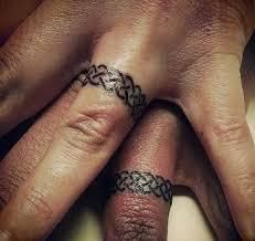 Many couples choose delicate, subtle tattoo designs that perfectly reflect the shape of the wedding ring [Pinterest]