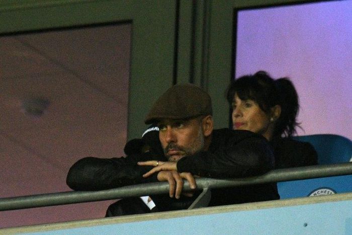 Manchester City manager Pep Guardiola looks on from the stands