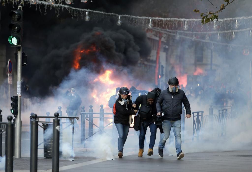 More than 1,300 were arrested and dozens injured after violent anti-government protests engulfed France — here's how the clashes unfolded
