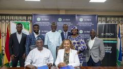Leadership of WAMI and EMTECH in a group photograph after the signing ceremony