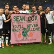 The Liverpool team, pictured May 2018, hold a tribute to Sean Cox