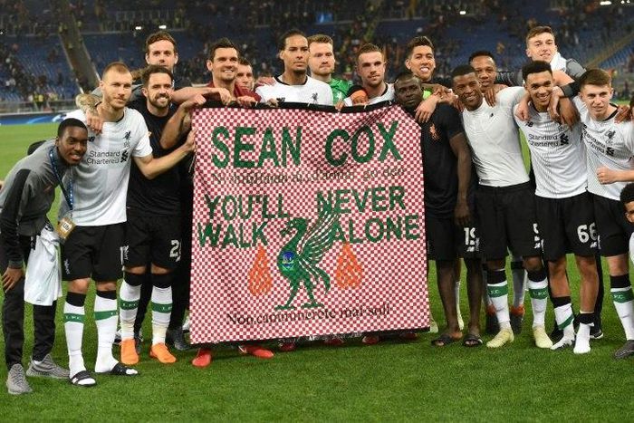 The Liverpool team, pictured May 2018, hold a tribute to Sean Cox