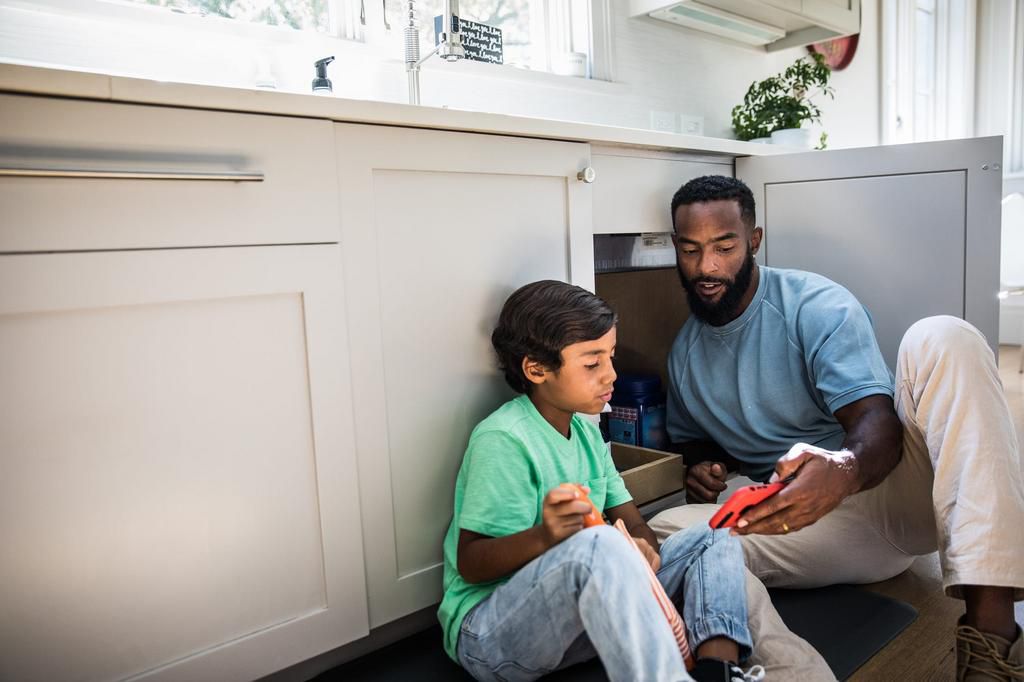 father and son doing home improvement project
