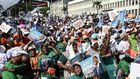 Supporters of Ivorian President Alassane Ouattara before his closing campaign rally in Abidjan.Photographer: Sia Kambou/AFP/Getty Images