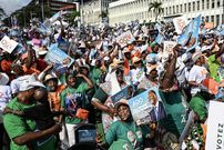 Supporters of Ivorian President Alassane Ouattara before his closing campaign rally in Abidjan.Photographer: Sia Kambou/AFP/Getty Images