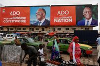 A campaign billboard promotes Ivory Coast President Alassane Ouattara, 83, who is seeking a fourth term, in Abidjan [File: Luc Gnago/Reuters]
