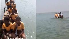 Students commuting to school in a canoe