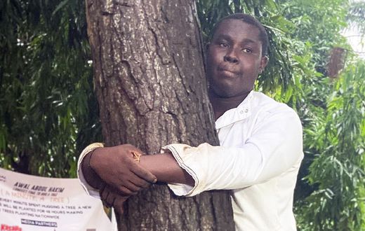 Abdul Hakim Awal hugs tree for 24 hours to break world record and promote reforestation