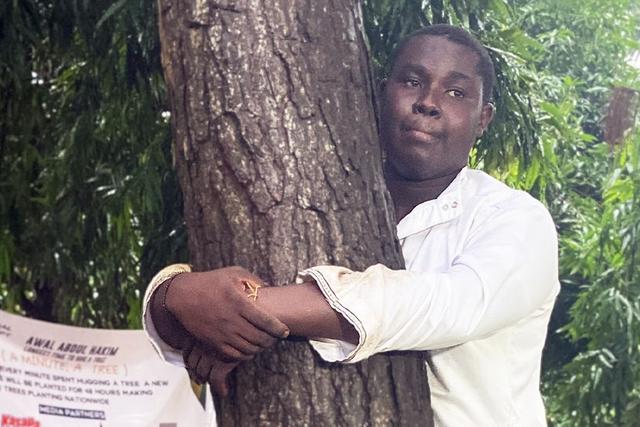 Abdul Hakim Awal hugs tree for 24 hours to break world record and promote reforestation