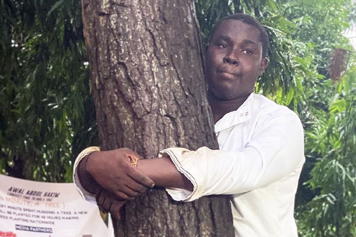 Abdul Hakim Awal hugs tree for 24 hours to break world record and promote reforestation