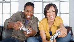 Young black couple playing video games
