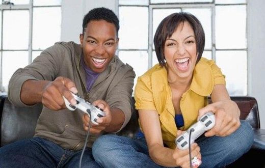 Young black couple playing video games