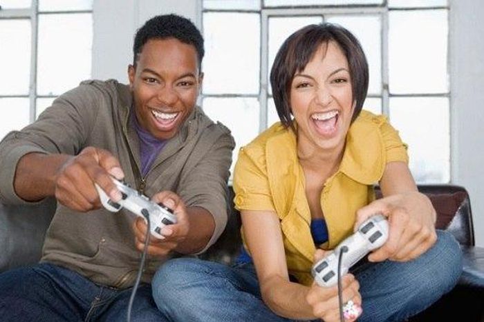Young black couple playing video games