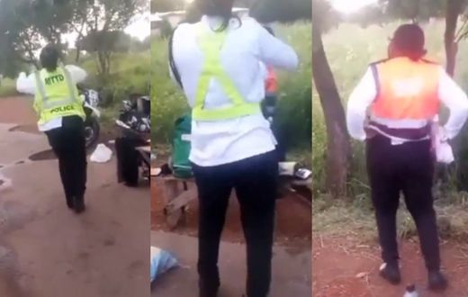 Police officers jam vigorously to political campaign song while at post