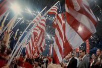 Teens hold United States flags at the 1972 Democratic National ConventionDisney General Entertainment Content via Getty Images)