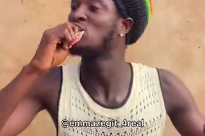 Content creator chews cedi note