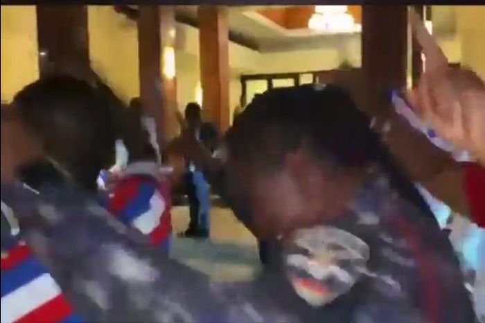 Policewoman celebrates with party supporters on ballot paper top spot