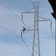 Man climbs pylon