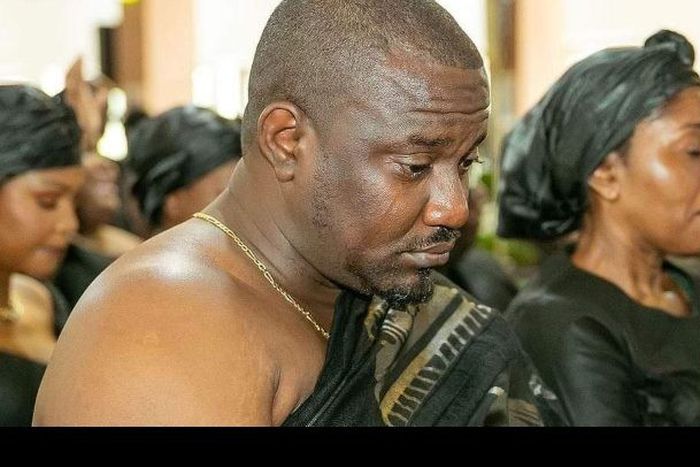 John Dumelo crying at mother's funeral