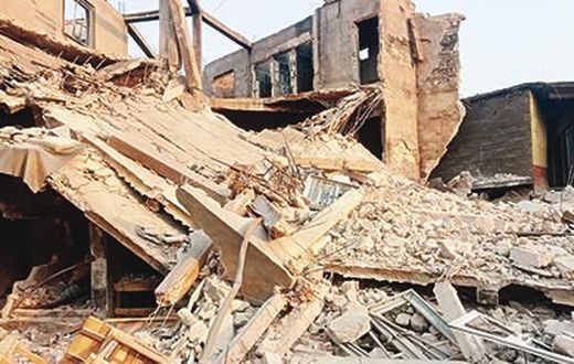 An illustrative image of a collapsed building. [Punch]