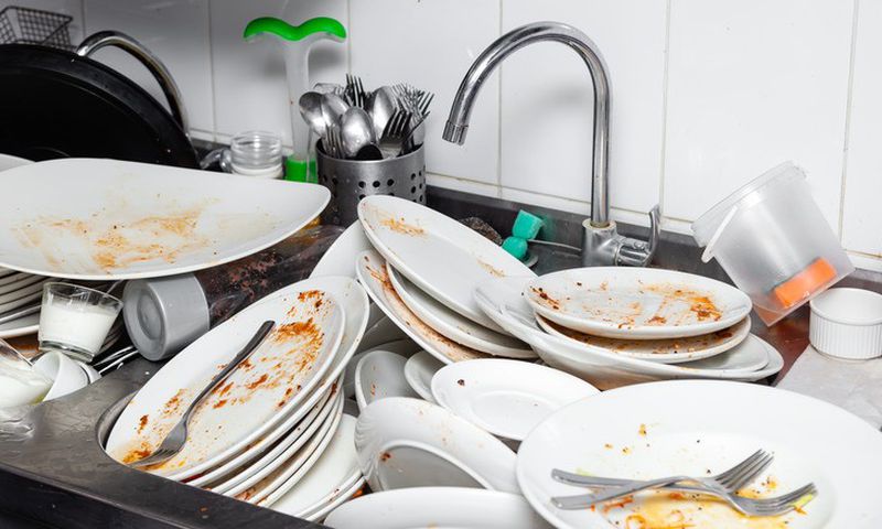You shouldn’t leave your dishes in the sink overnight [Shutterstock]
