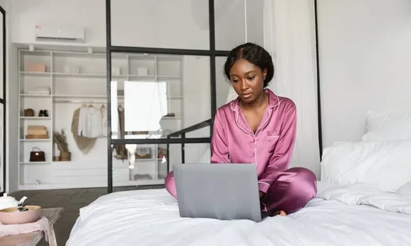 Dangers of using your laptop in bed [Depositphotos]