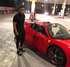 Ibrah One showing off one of his cars