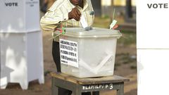 A voter casting his ballot in an election