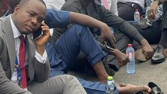 NPP MPs sitting on floor