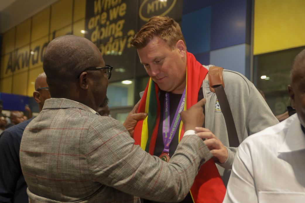 Kim Lars Bjorkegren and GFA President Kurt Okraku