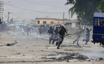 Demonstrators engage police during a protest calling for President Faure Gnassingbe's resignation in Lome, Togo on June 26. (AP)
