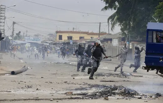 Demonstrators engage police during a protest calling for President Faure Gnassingbe's resignation in Lome, Togo on June 26. (AP)