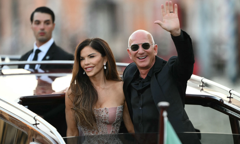 The newly-married couple, Jeff Bezos and Lauren Sanchez as they leave the Aman Hotel on the third day of their wedding festivities in Venice, Italy. [Marco Bertorello/AFP/Getty Images]