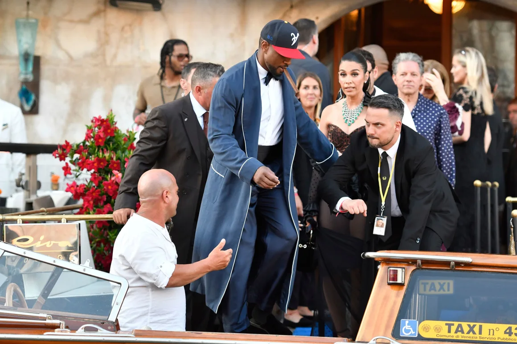 Usher and other guests pictured. [Luigi Costantini/AP]