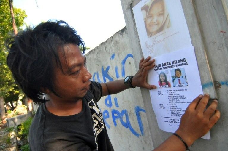 Thousands are missing, presumed dead, after entire neighbourhoods were swallowed up by liquefaction