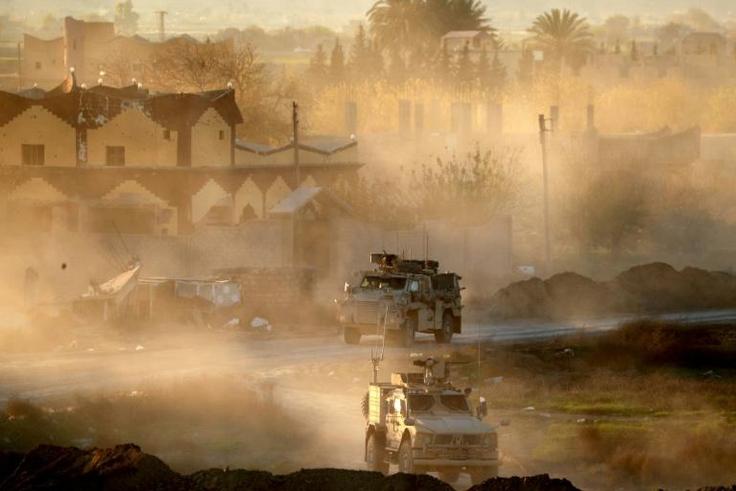 US army vehicles supporting the Syrian Democratic Forces (SDF) pictured in Hajin, eastern Syria, on December 15, 2018