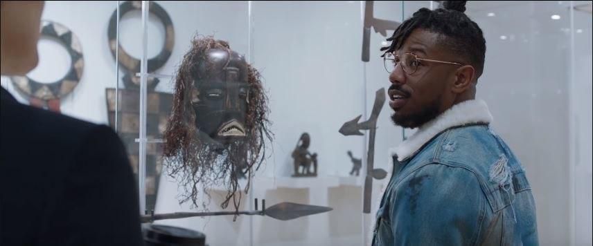 Killmonger in a British museum listening to a white female guide telling him about African artifacts