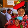 A voter in Ollantaytambo, near the ancient imperial Inca capital of Cuzco, shows her identity card as Peruvians voted on constitutional reforms aimed at curtailing corruption