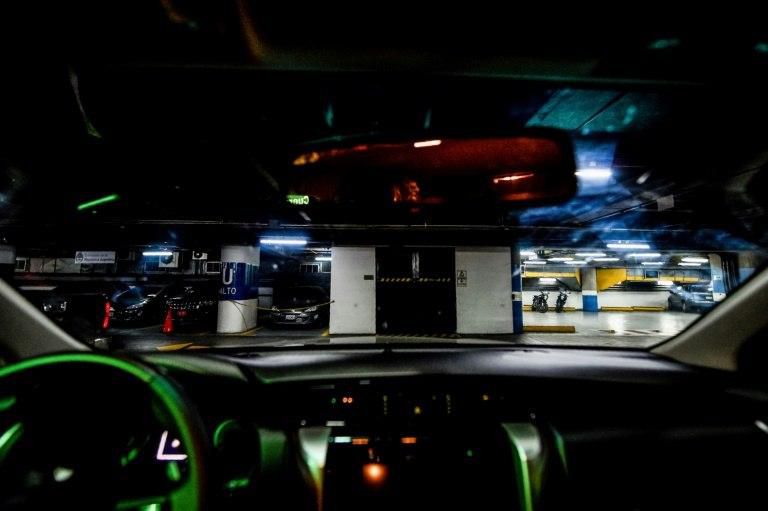 View through car safety glass at a garage of armoured cars in Caracas, Venezuela, where even low-end vehicles are getting safety reinforcements