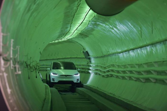Elon Musk, co-founder and chief executive officer of Tesla, arrives in a modified Tesla Model X electric vehicle during an unveiling event for the Boring Co. Hawthorne test tunnel in Hawthorne, south of Los Angeles