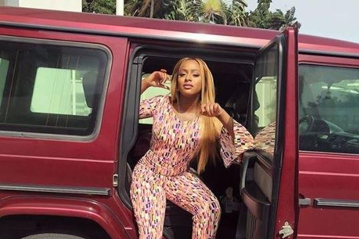 DJ Cuppy with one of her dad's G Wagon