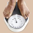 ___9155604___2018___11___30___22___man-standing-on-weighing-scales-royalty-free-image-956351584-1543528449