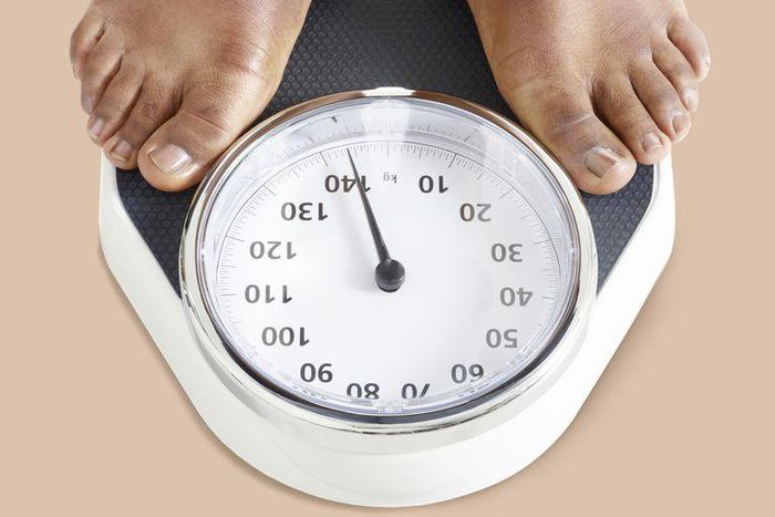 ___9155604___2018___11___30___22___man-standing-on-weighing-scales-royalty-free-image-956351584-1543528449