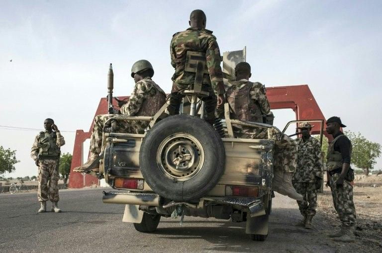 Nigerian soldiers prepare to head off on patrol to search for Boko Haram militants outside Maiduguri in Borno State, in Nigeria's northeast on March 25, 2016