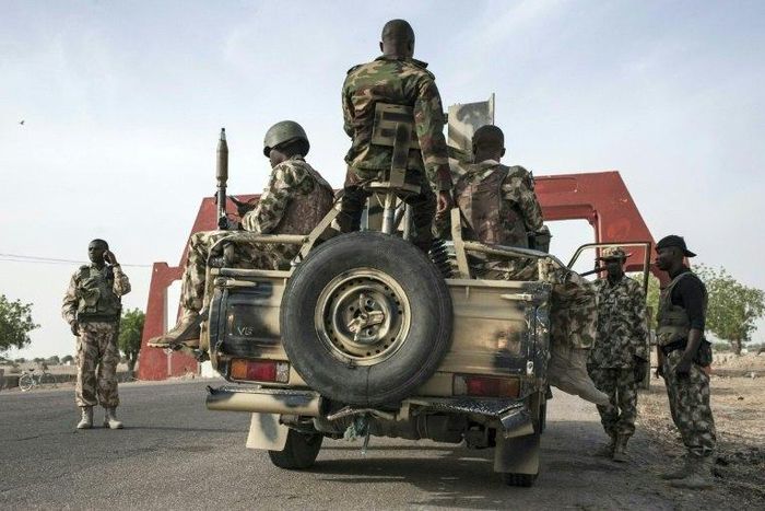 Nigerian soldiers prepare to head off on patrol to search for Boko Haram militants outside Maiduguri in Borno State, in Nigeria's northeast on March 25, 2016