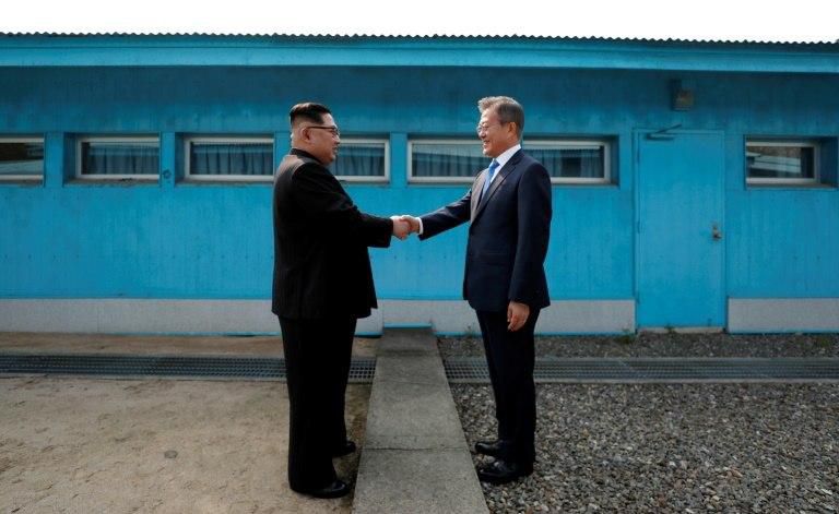 North Korea's leader Kim Jong Un (L) and South Korea's President Moon Jae-in have met three times in 2018 -- the first was in April at the truce village of Panmunjom but they first shook hands at the Military Demarcation Line dividing their nations